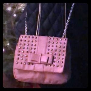 Crossbody in pink with studs.